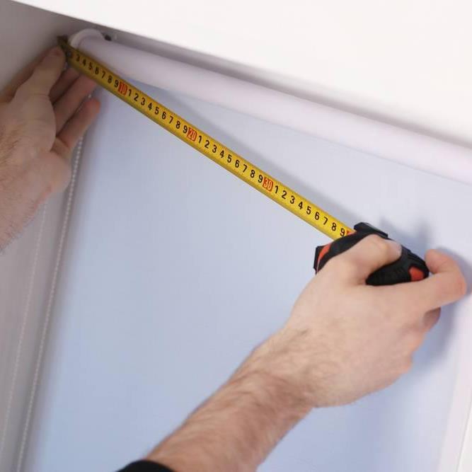 How do I cut a ready made roller blind to size?