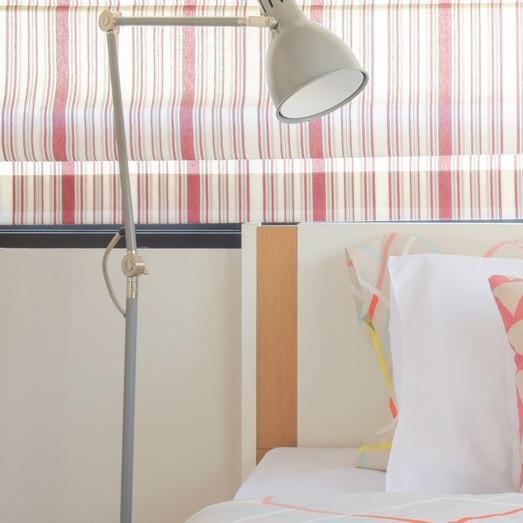 Add a touch of sophistication to your bedroom with patterned blinds